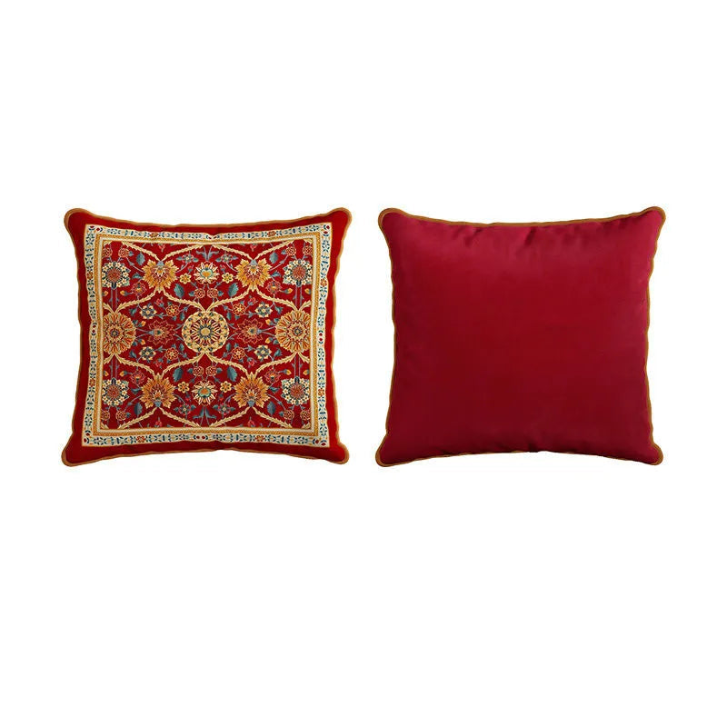 "Crimson Court" Persian velvet cushion cover front and back — deep crimson ground with all-over amber, teal and ivory medallion floral pattern with ornate border on front, plain crimson velvet reverse with gold piping — CL House