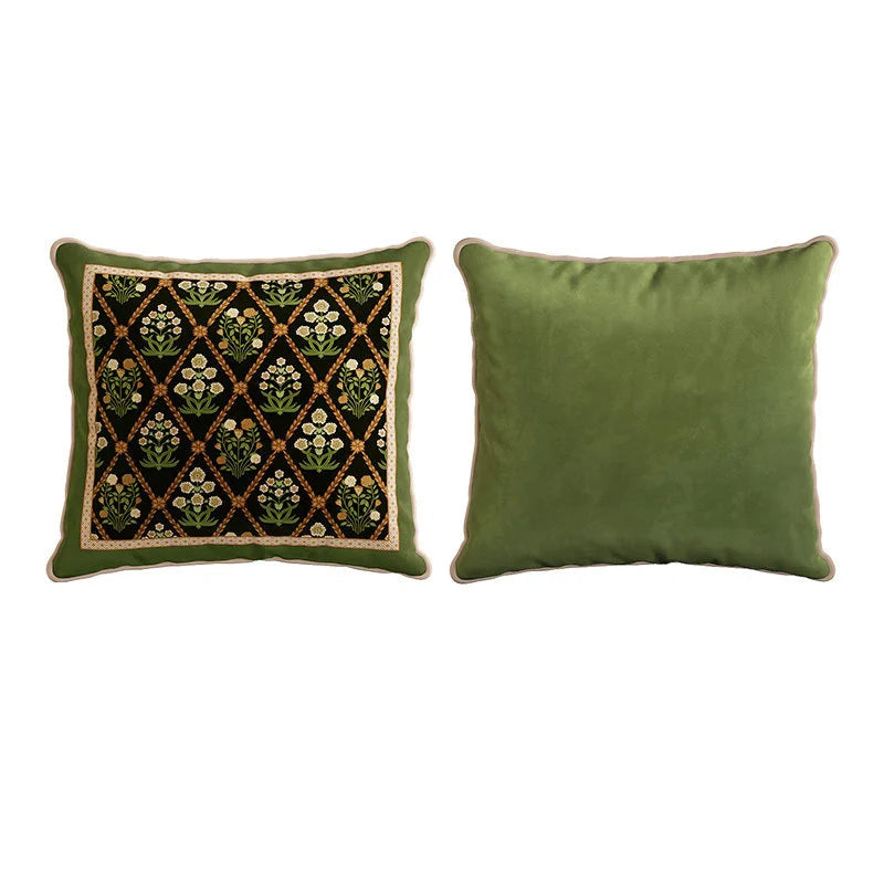 "Midnight Trellis" Indo-Persian velvet cushion cover front and back — black ground with gold diamond trellis and white and yellow floral bouquets, ornate cream border on front, plain sage green velvet reverse with cream piping — CL House