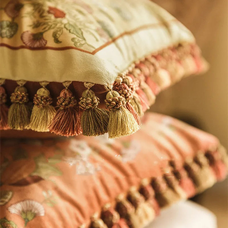 Close-up of handcrafted multicolour tassels on the "Vitality" botanical embroidery cushion cover — golden and terracotta tones — CL House & Home