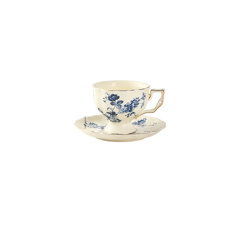 "Lemon Garden" porcelain tea cup and saucer with hand-painted blue peony floral motif and gold trim — CL House & Home