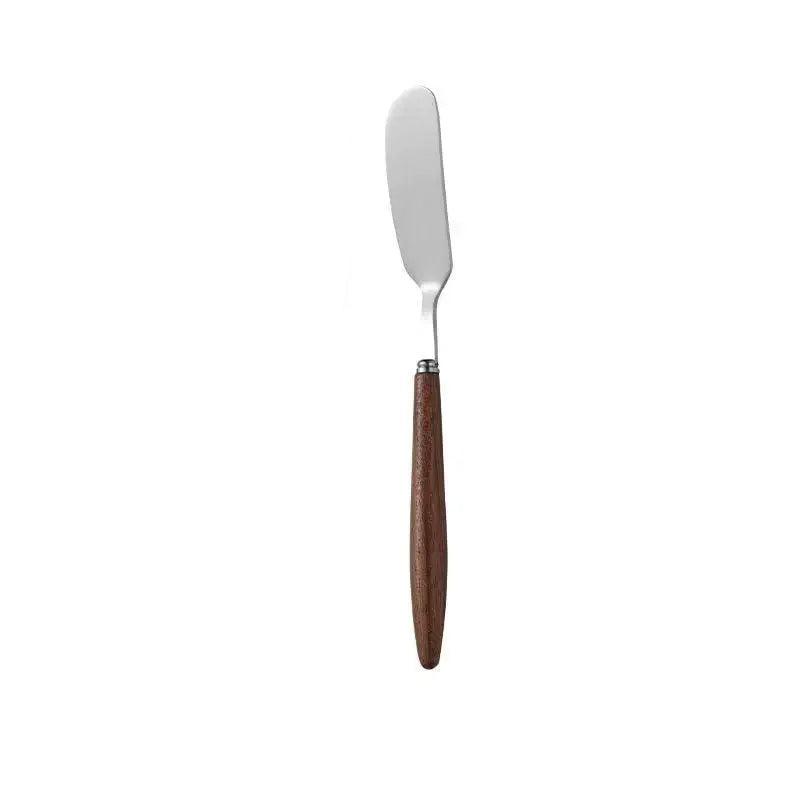 "Walnut Stem" butter and cheese knife — full front view on white background showing stainless steel blade and solid walnut wood handle — product shot