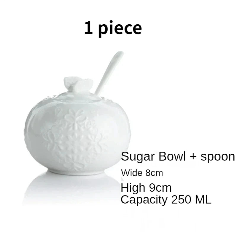 (Sugar Bowl):
"White embossed bone china sugar bowl with lid, floral relief and spoon — CL House Tea Time"