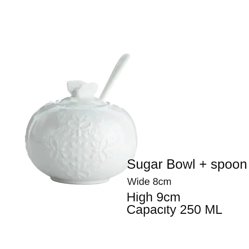 (Sugar Bowl):
"White embossed bone china sugar bowl with lid, floral relief and spoon — CL House Tea Time"
