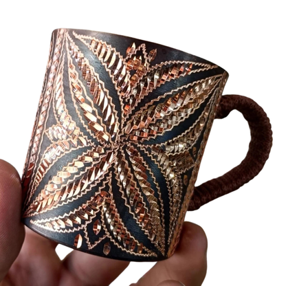 "Artisan's Mark" pure copper mug held in hand, close-up of engraved pattern — CL House