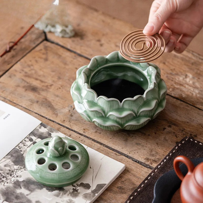  Lotus Bloom celadon ceramic incense burner open — hand placing incense stick inside — CL House