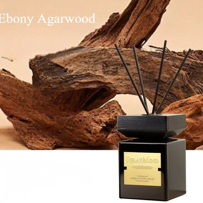 Signature Scent reed diffuser — Ebony Agarwood — black matte bottle with gold label and dark reed sticks — CL House