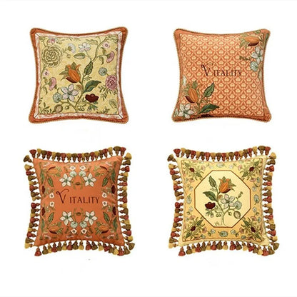 "Vitality" botanical embroidery cushion cover collection — four designs in golden yellow and terracotta with floral motifs and multicolour tassels — CL House & Home