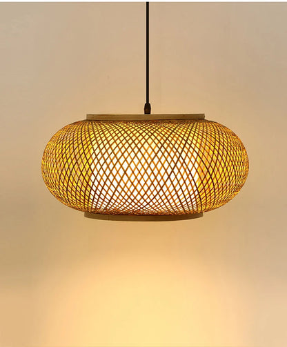 "Weave & Disc" hand-woven bamboo pendant light with open lattice disc shade glowing warm amber light, black cord, neutral beige background