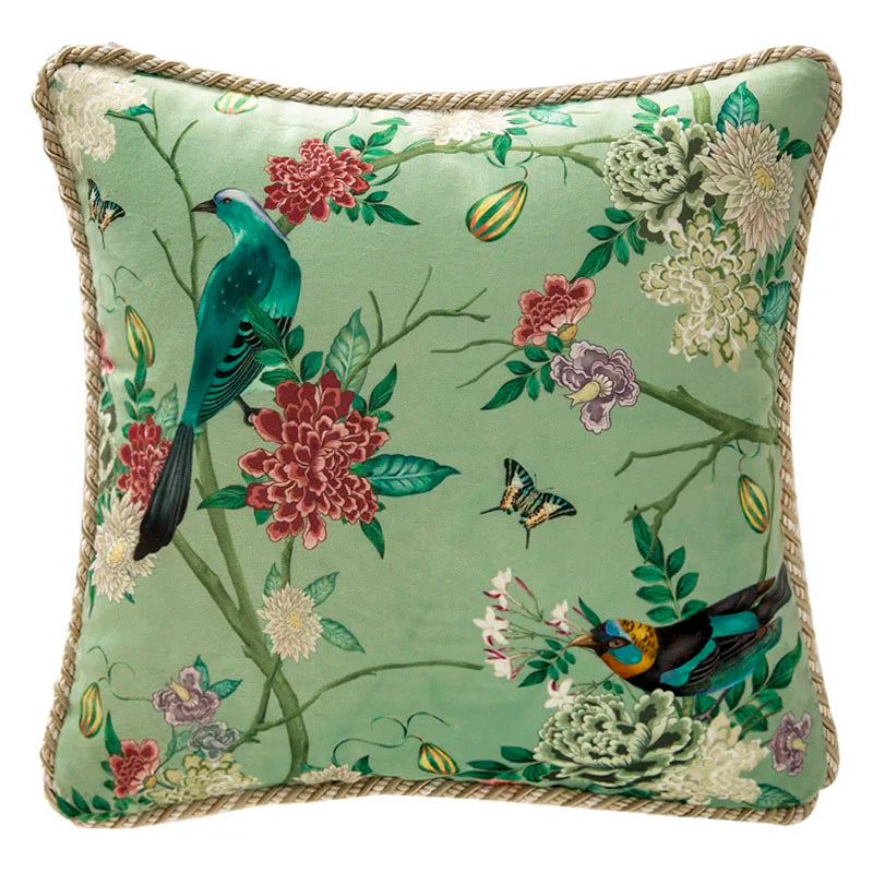 "Garden Silk" velvet cushion cover, Springing design — sage green ground with turquoise long-tailed bird and exotic companion on flowering branches, peonies, chrysanthemums and butterflies, gold braided piping trim

