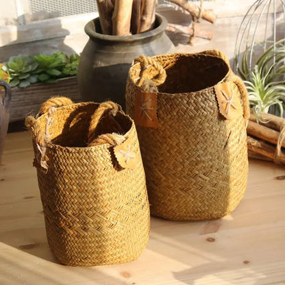 Small and large natural straw flower basket vases displayed together to show the difference in size.