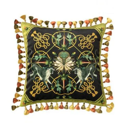 "Tropical Reverie" velvet cushion cover, Midnight Hummingbird design — dark ground with mirrored hummingbirds in flight, golden rope motifs and white lotus bloom, multicolour tassel trim