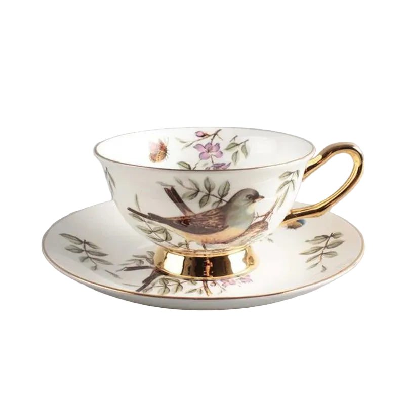  Cherry Blossom:

"White bone china teacup and saucer with cherry blossom songbird print and gold trim — CL House Tea Time" 