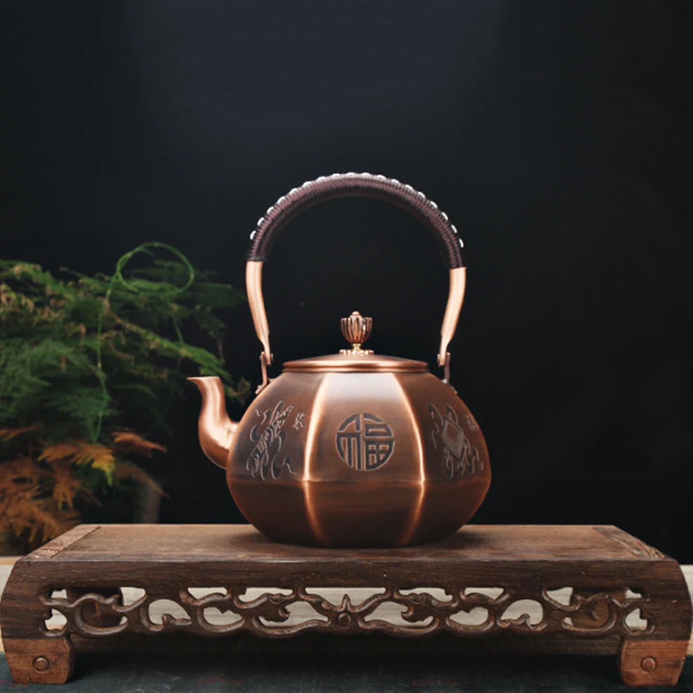 "Dynasty Forge" octagonal copper kettle on wooden display stand with teacups — CL House