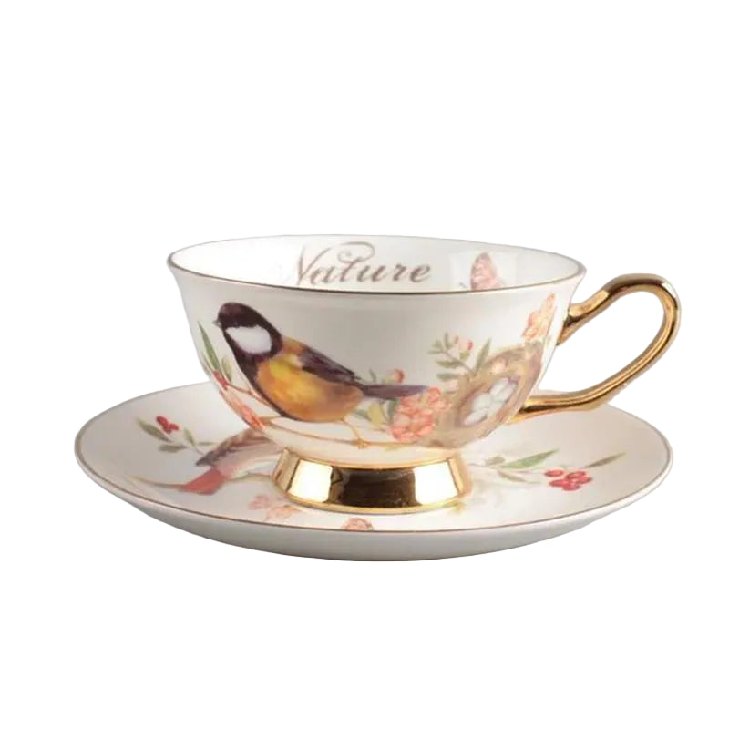 Great Tit:

"White bone china teacup and saucer with great tit bird on branch print and gold trim — CL House Tea Time"