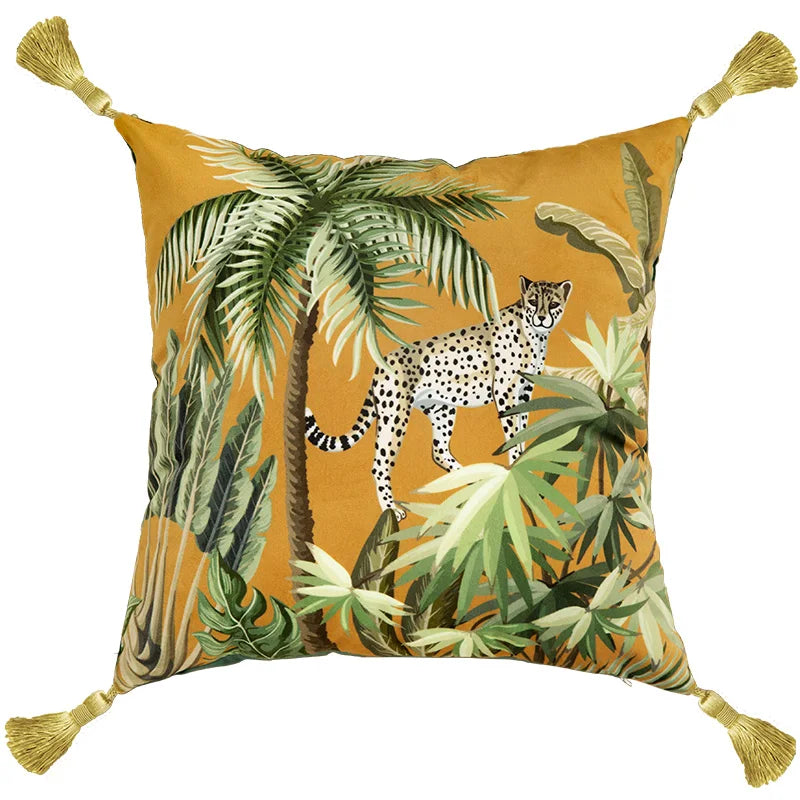  "Wild Kingdom" velvet cushion cover, Savanna Leopard design — ochre ground with leopard resting on tropical palm, lush green foliage and banana leaves, gold corner tassels
