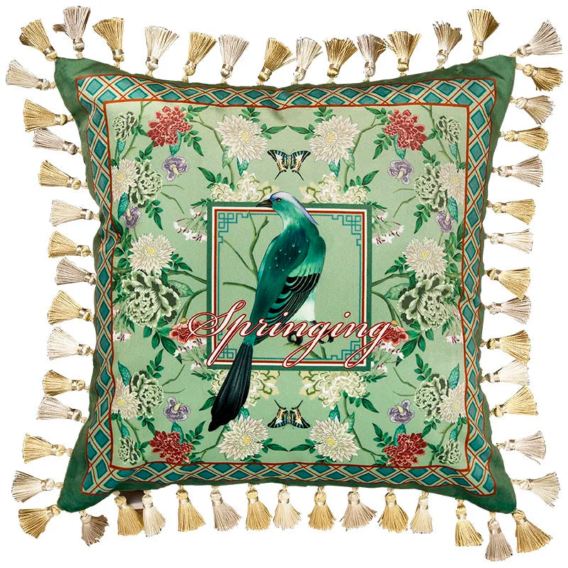 "Garden Silk" velvet cushion cover, Springing with tassels — sage green ground with turquoise long-tailed bird in central framed panel, "Springing" script, dark green diamond border, chrysanthemums and peonies, gold and cream