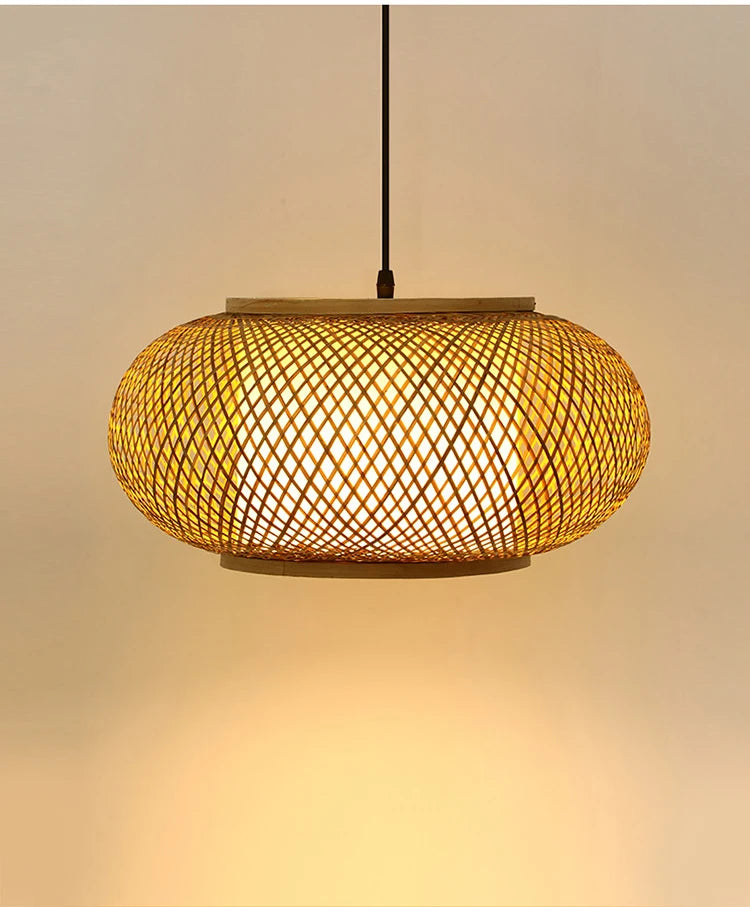 "Weave & Disc" hand-woven bamboo pendant light with open lattice disc shade glowing warm amber light, black cord, neutral beige background