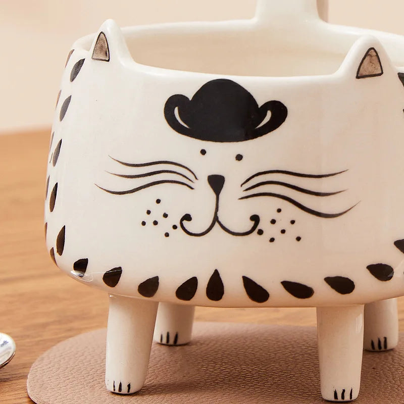 tea mug

paws & pour

novelty mug

microwave safe mug

dishwasher safe mug

cute mug

coffee mug

ceramic mug

ceramic cat mug

cat mug with legs

cat mug

cat lover gift