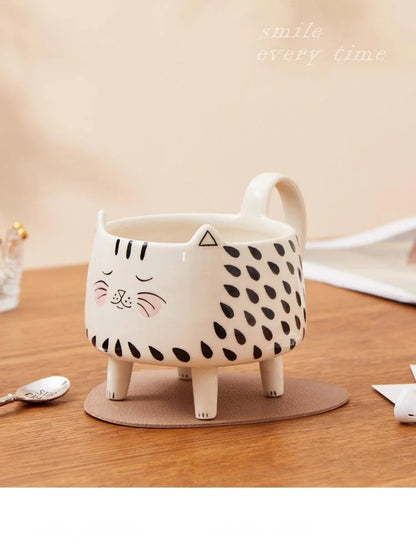 tea mug

paws & pour

novelty mug

microwave safe mug

dishwasher safe mug

cute mug

coffee mug

ceramic mug

ceramic cat mug

cat mug with legs

cat mug

cat lover gift