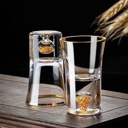 "Gold Sculpture" crystal shot glasses in Fortune variant on a table — CL House Drinkware collection
