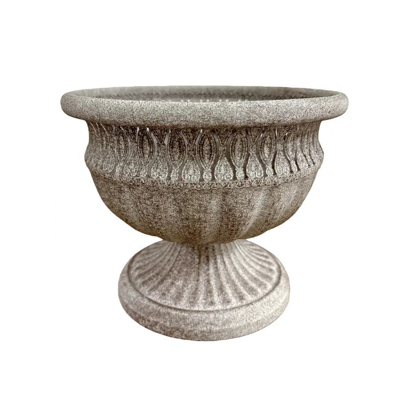 "Roman Urn" ornate stone-texture garden urn planter, Stone Grey finish, fluted pedestal base with acanthus leaf relief pattern, wide mouth opening, shown on white background

