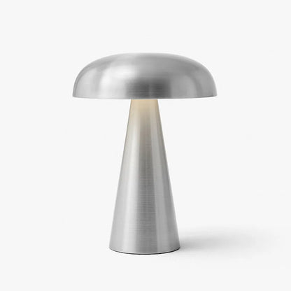  Cap & Glow mushroom table lamp in Silver brushed metal finish, with warm LED light glowing through the neck, on a light grey background.