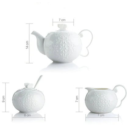 (Teapot):

"White embossed bone china teapot with floral relief and sculpted handle, British style — CL House Tea Time"
