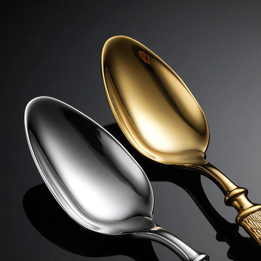  Close-up of "Twisted Rope" dinner spoons in Silver and Gold finish on a dark reflective surface — showing the deep mirror polish and elegant bowl shape