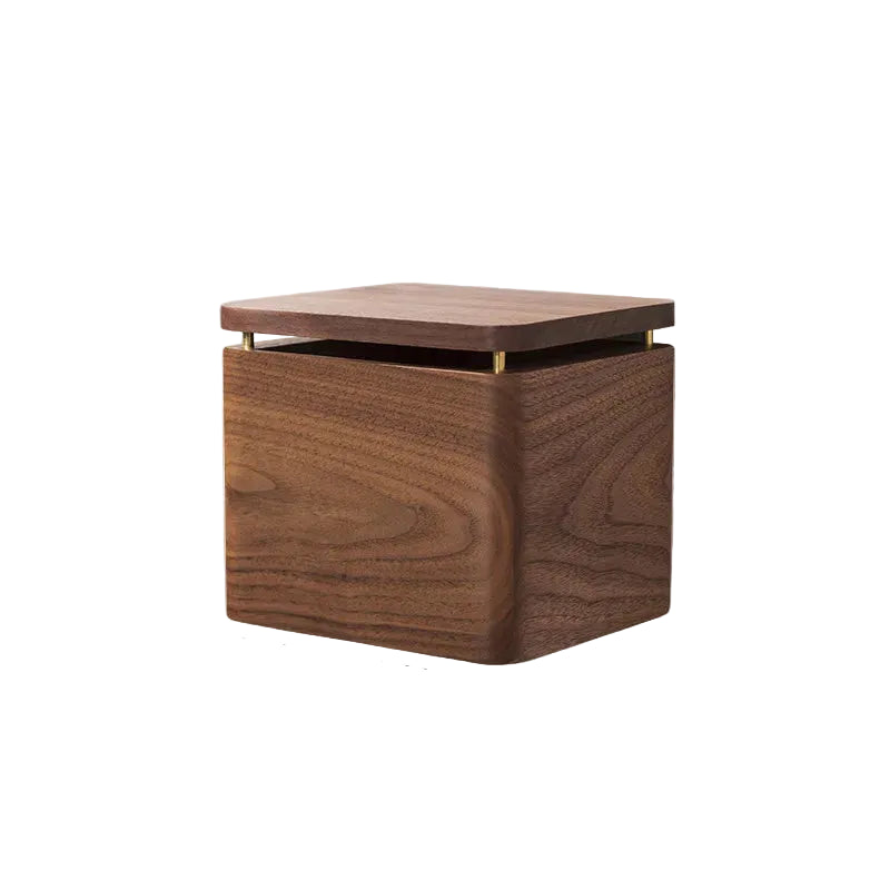 Wall-mounted walnut wood tissue and paper roll holder with brass hardware and hinged lid, warm dark grain — japandi bathroom accessory