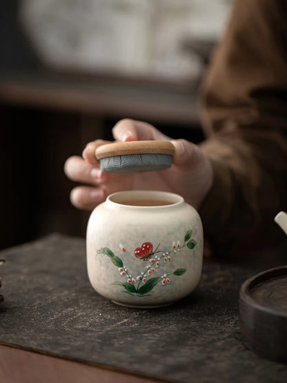 Hand-painted tea jar

Ceramic tea caddy 

Portable tea storage

Pu-erh tea canister

Moisture-proof tea can

Artisan ceramic storage

Small tea tin alternative

Luxury tea accessories
