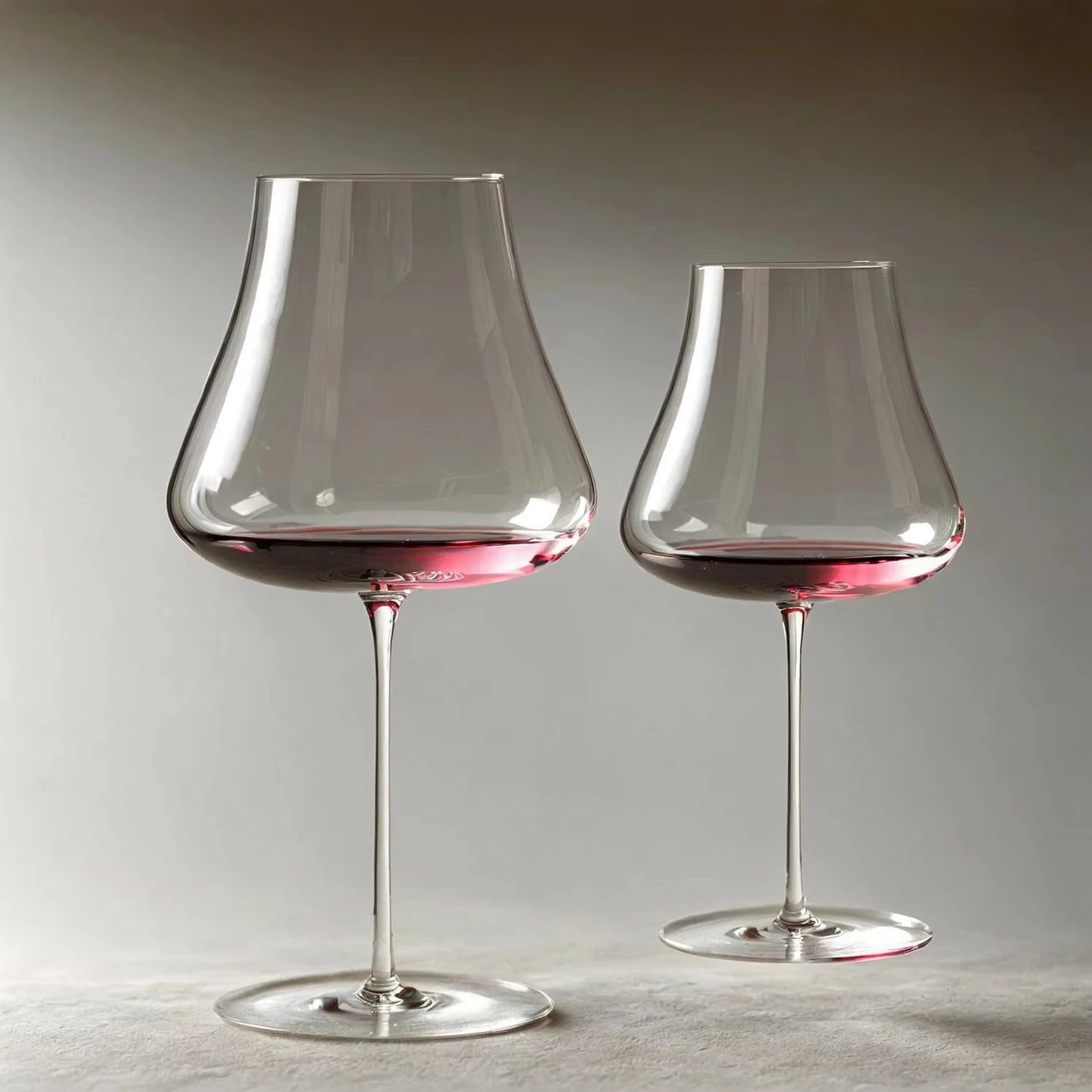  "Sommelier" wide bowl crystal wine glass filled with red wine, elegant long stem — CL House Drinkware collection