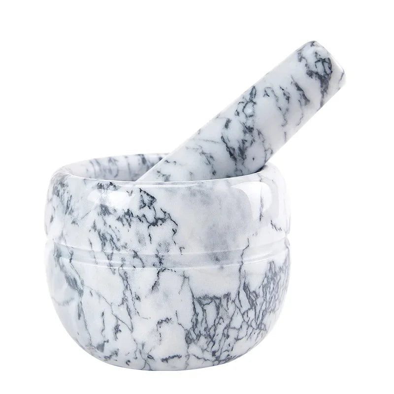 alt text: White marble mortar and pestle set with dark grey veining on white background — polished natural marble bowl with matching pestle, side view — White Marble variant of the Stone Grind Mortar & Pestle Set by CL House