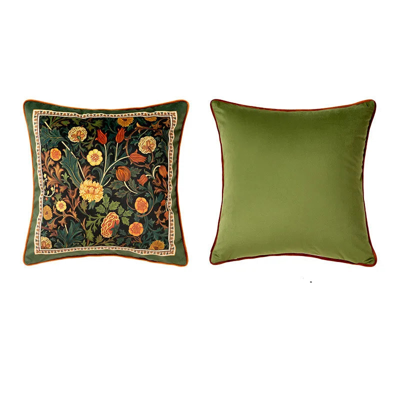  "Dark Meadow" botanical velvet cushion cover — deep forest green ground with dense William Morris-style floral print, tulips, marigolds and acanthus in amber and orange, sage green reverse with terracotta piping, 45×45cm — CL House