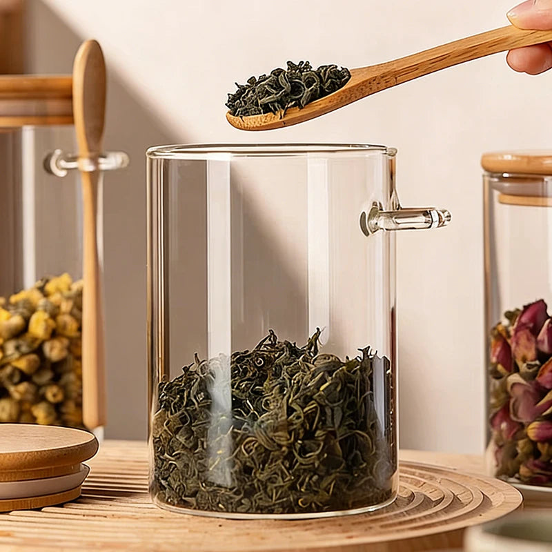 Glass storage jar with spoon

Bamboo lid kitchen canister

Airtight food container 

Kitchen organisation jars

Coffee and tea glass jar

Sustainable spice storage

Pantry glass canisters

Minimalist kitchen decor

550ml glass storage