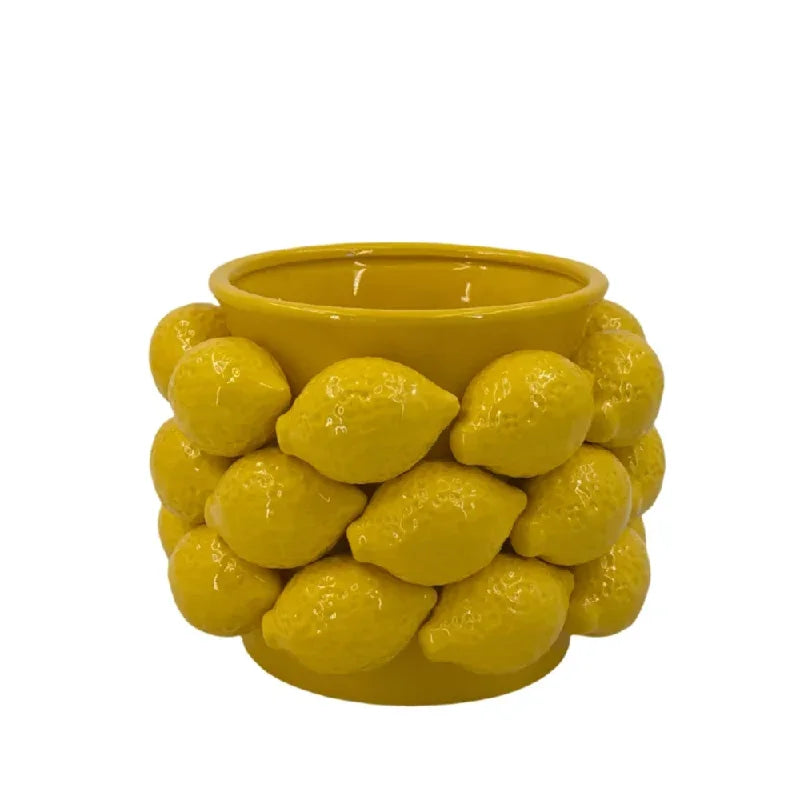 Close-up of yellow ceramic Large Bowl vase with oversized lemon relief detailing and glossy sunshine yellow glaze, showing open top and textured surface, white background