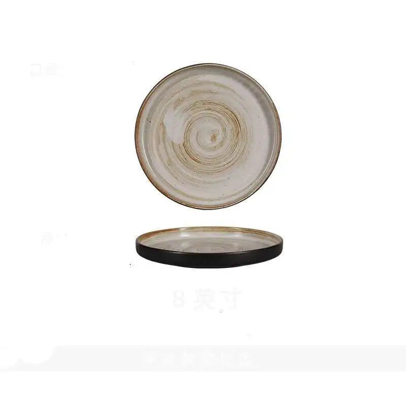  "Spiral Sand" ceramic dinner plate in warm beige with golden reactive spiral glaze and dark straight raised edge — top view and side profile on white background