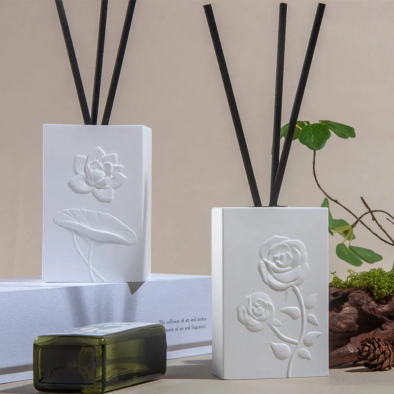 "Lotus Bloom" ceramic reed diffuser — white porcelain with rose embossed relief — artisan home fragrance set — CL HouseCL House