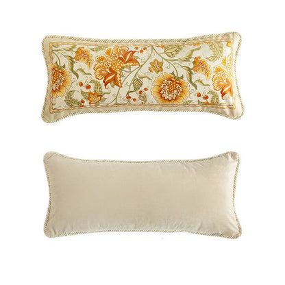 "Amber Bloom" lumbar cushion cover front and back view, ivory velvet with dense amber and gold floral embroidery, braided edge trim, plain ivory reverse — CL House Cushions collection