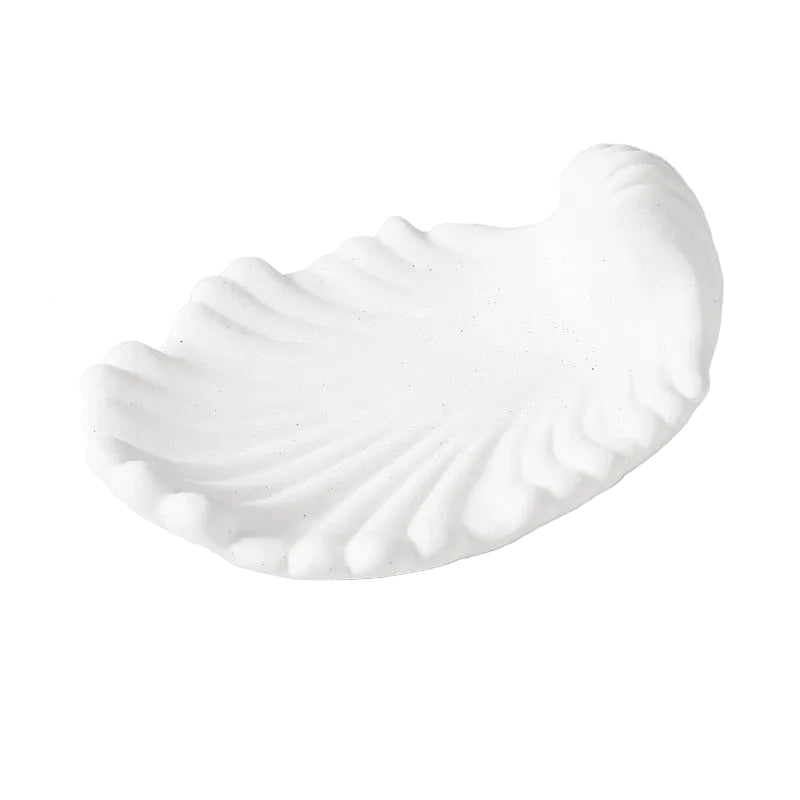  Chalk white matte ceramic shell soap dish, angled view on white background showing soft ridged texture and clean scallop form