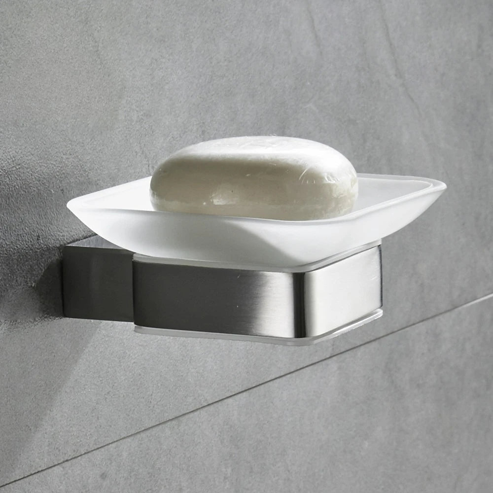  Wall-mounted frosted glass soap dish with brushed nickel stainless steel bracket installed on grey tile wall, white bar soap displayed