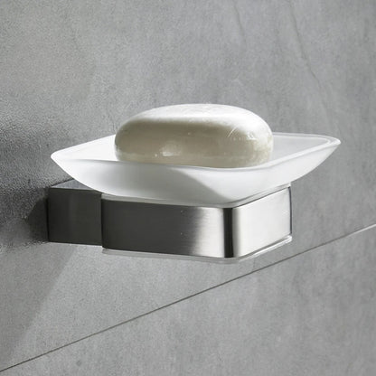  Wall-mounted frosted glass soap dish with brushed nickel stainless steel bracket installed on grey tile wall, white bar soap displayed