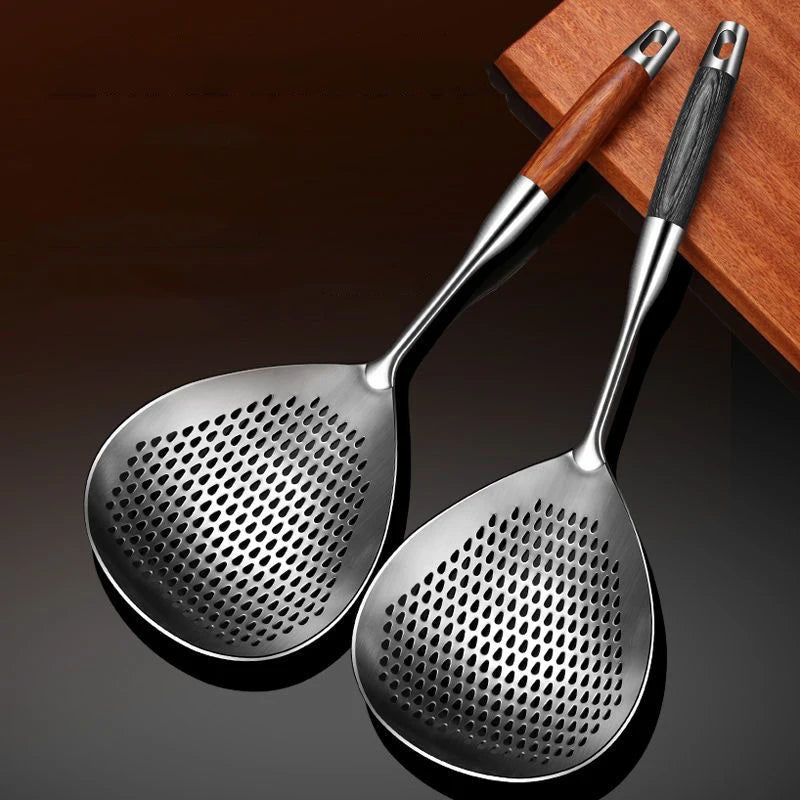 Two stainless steel wok skimmers with wooden handles, rosewood and dark wood, displayed on a wooden surface
