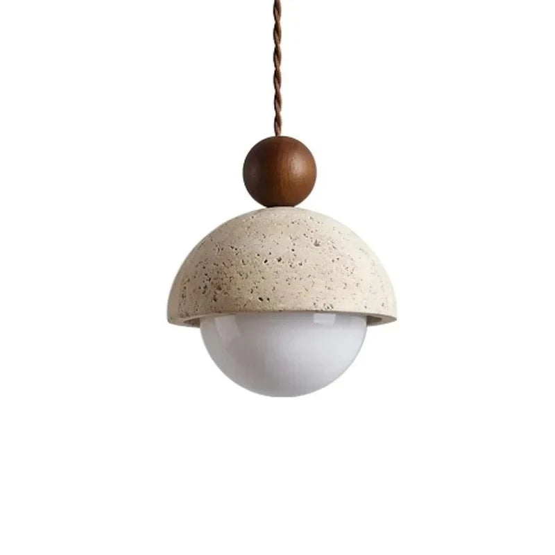 Stone & Orb travertine pendant light with textured cream stone dome, frosted glass globe and walnut wood bead, unlit product shot on a white background