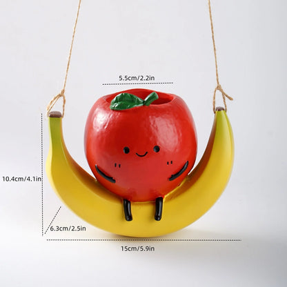 Fruit shaped hanging planter

Banana swing plant pot

Cute apple succulent holder

Hanging orange flower pot

Novelty garden ornaments

Small indoor hanging pots

Unique gift for plant lovers

