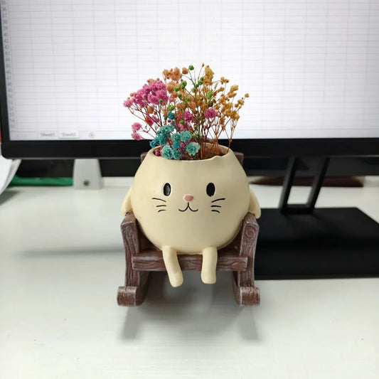 Cat rocking chair planter

Cute succulent pot 

Desk stress relief ornament

Resid cat flower pot

Mini planter with drainage

Whimsical office decor

Rocking chair plant holder

Gift for cat lovers

Creative tabletop statue