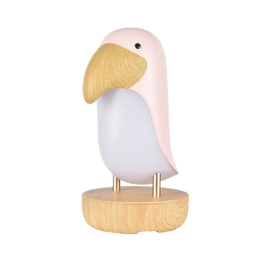 White silicone bird-shaped LED night light with solid wood base and gold metal legs, on a white background