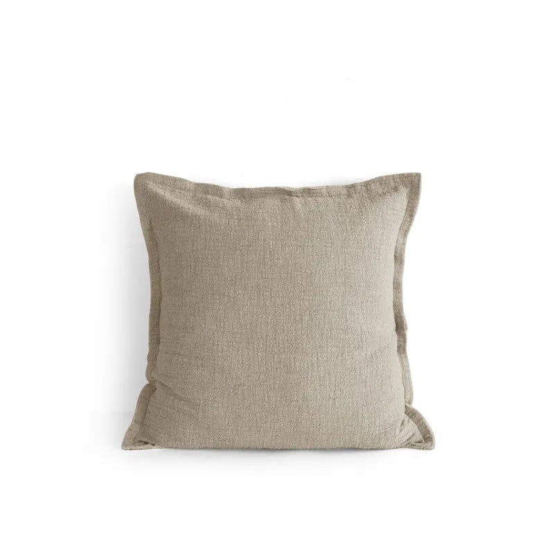Natural linen square cushion cover with subtle textured weave and fringe edge detail, photographed on a white background — ramie-linen blend, 50x50cm, minimalist wabi-sabi home decor.