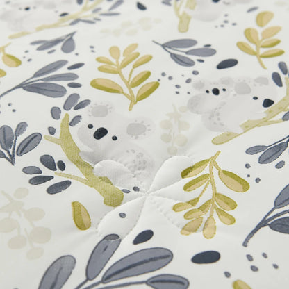 Close-up of Willow Garden ice silk cooling summer quilt showing detailed botanical leaf print with hidden koala motif and quilted stitching texture