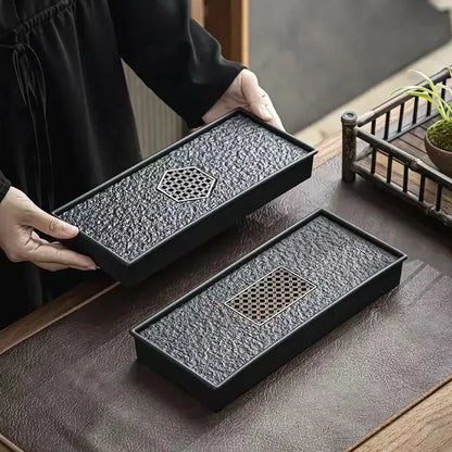 Gongfu Cha Pan Stone Drainage Tea Tray – two size comparison, hexagonal carved lattice detail, held by hands | CL House