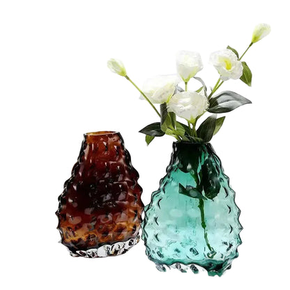 Glacier Peak textured glass vases in Amber Brown and Ocean Teal styled with white roses, white background